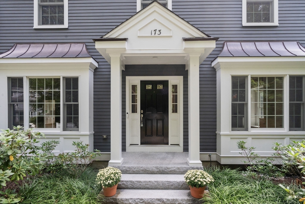 173 Benvenue Street Wellesley, MA 02482 - Photo 3 of 34 a view of a brick house with large windows