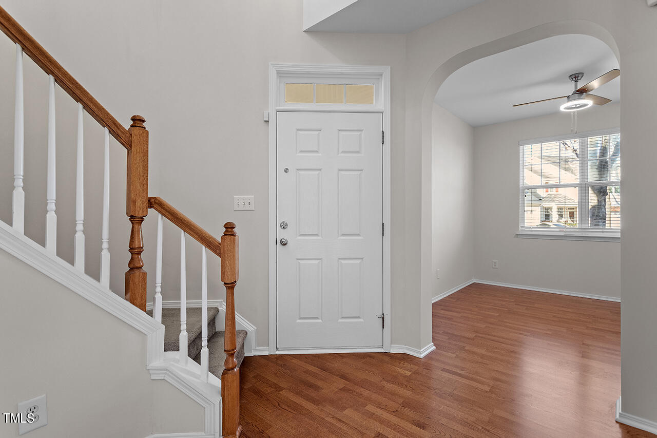 8307 Rubblestone Path Raleigh, NC 27613 - Photo 8 of 36 a view of an entryway with wooden floor