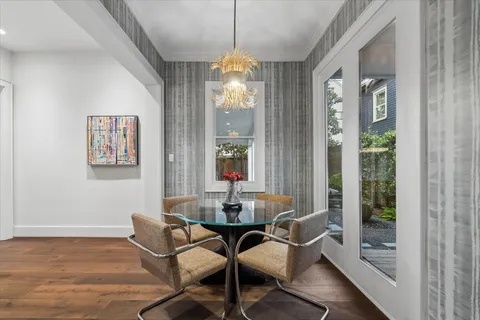 a dining room with furniture and window