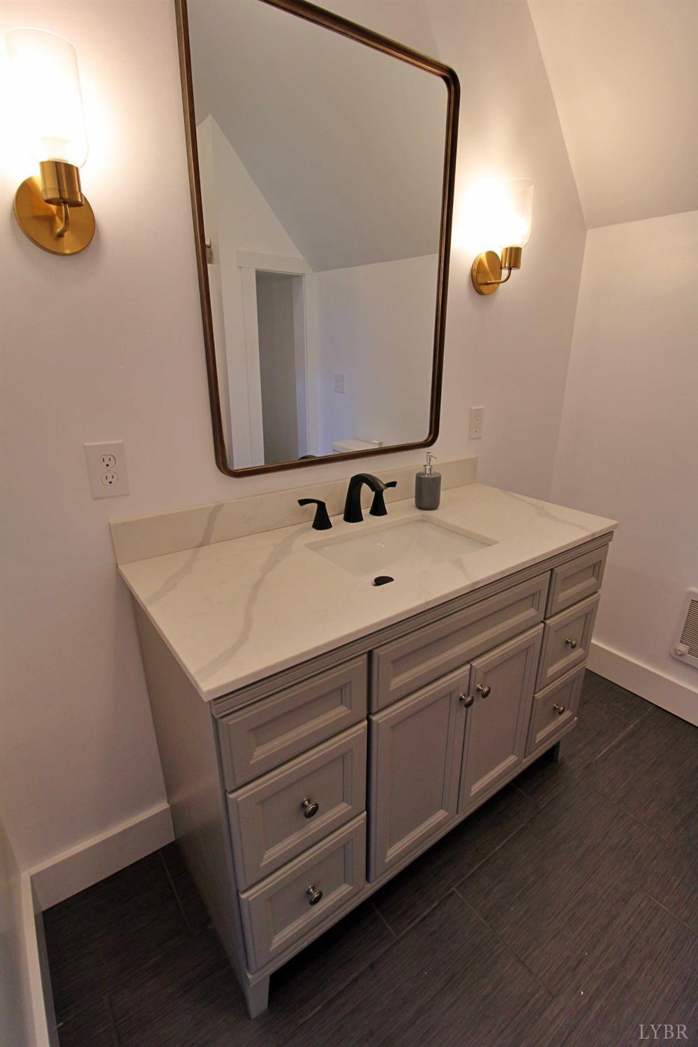 190 Ridge Road Prospect, VA 23960 - Photo 7 of 37 a bathroom with a sink vanity and mirror