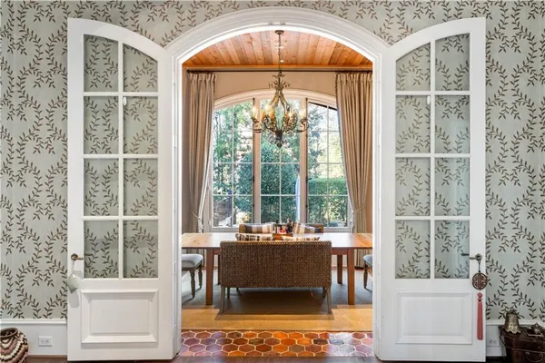 a living room with a large window and table