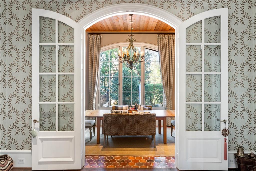 675 West Paces Ferry Road Northwest, Unit 10 Atlanta, GA 30327 - Photo 12 of 47 a living room with a large window and table