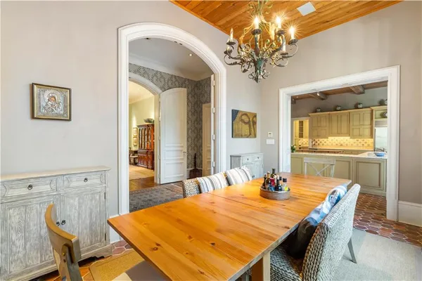 a dining room with a table and chairs