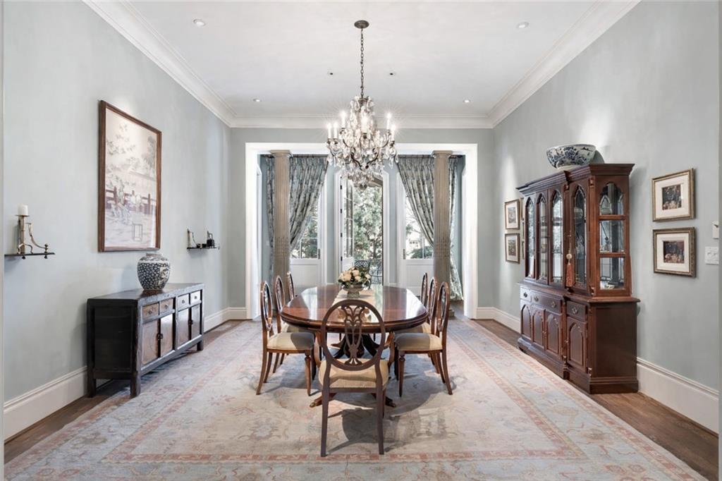 675 West Paces Ferry Road Northwest, Unit 10 Atlanta, GA 30327 - Photo 16 of 47 a view of a dining room with furniture and chandelier