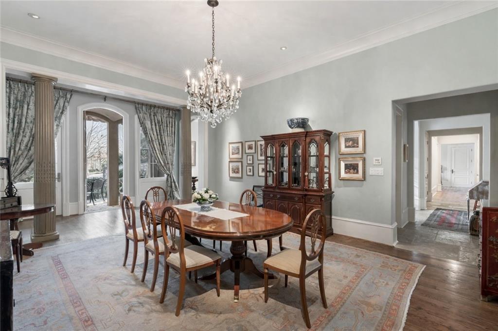 675 West Paces Ferry Road Northwest, Unit 10 Atlanta, GA 30327 - Photo 17 of 47 a view of a dining room with furniture window and wooden floor