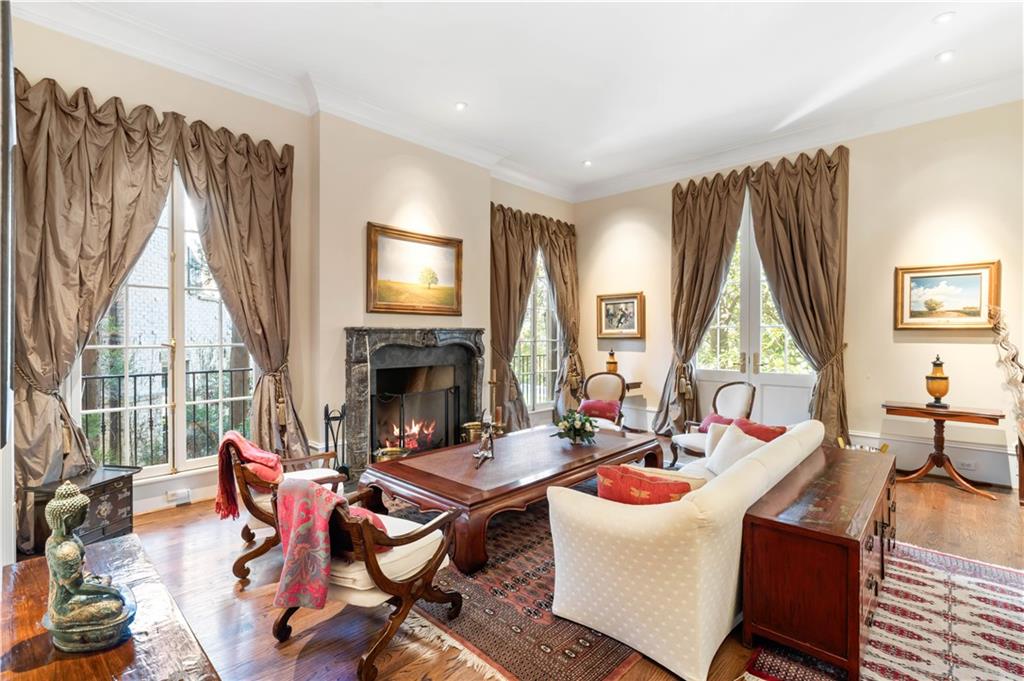 675 West Paces Ferry Road Northwest, Unit 10 Atlanta, GA 30327 - Photo 19 of 47 a living room with furniture fireplace and a large window