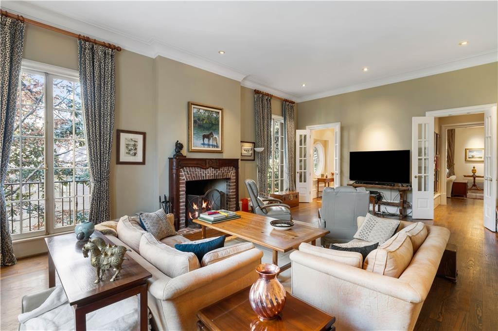 675 West Paces Ferry Road Northwest, Unit 10 Atlanta, GA 30327 - Photo 21 of 47 a living room with furniture a flat screen tv and a fireplace