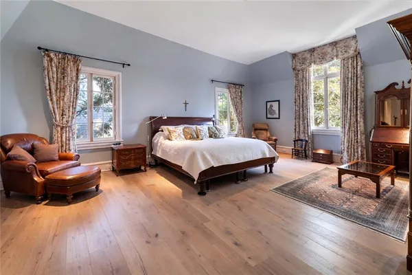 a bedroom with a bed and a couch