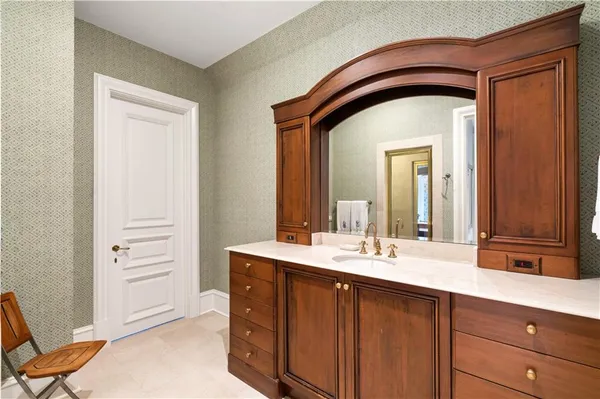 a bathroom with a double vanity sink and a mirror