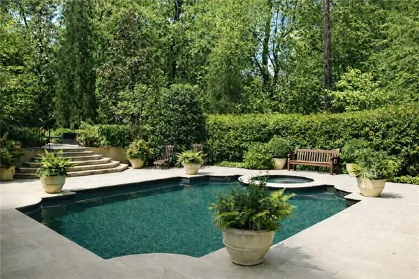 a view of a backyard with sitting area