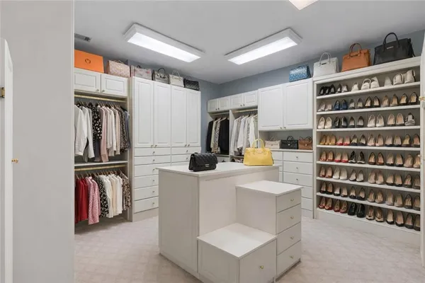 a utility room with sink dryer and washer