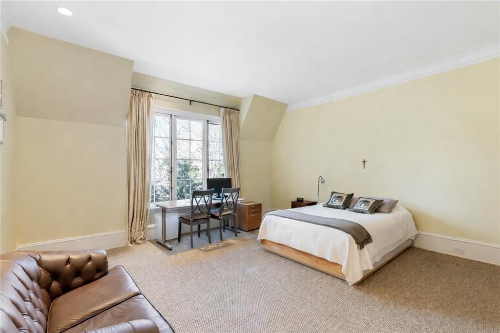 675 West Paces Ferry Road Northwest, Unit 10 Atlanta, GA 30327 - Photo 36 of 47 a bedroom with a bed and a couch