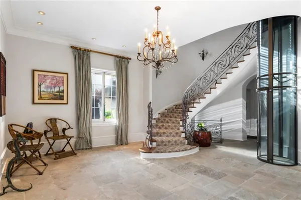 a view of hall way with furniture
