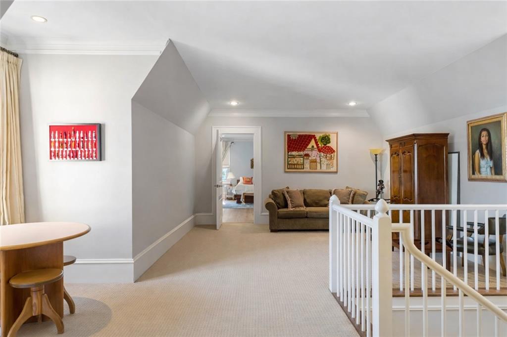 675 West Paces Ferry Road Northwest, Unit 10 Atlanta, GA 30327 - Photo 43 of 47 a living room with furniture and a flat screen tv