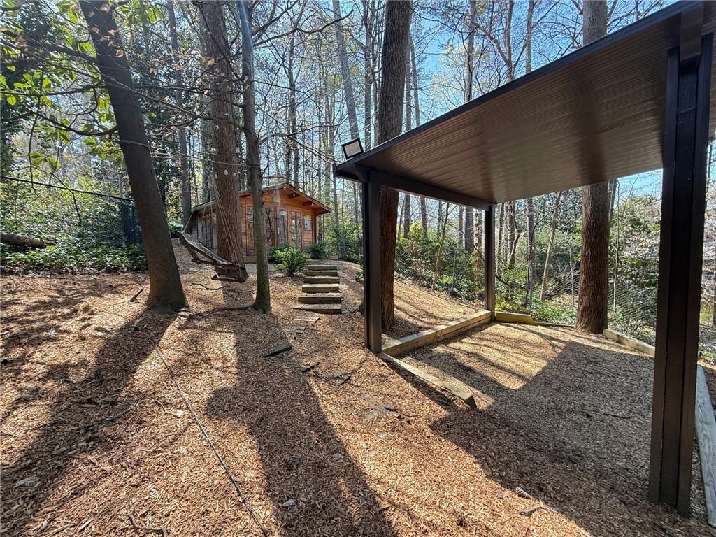 675 West Paces Ferry Road Northwest, Unit 10 Atlanta, GA 30327 - Photo 45 of 47 a view of a backyard with large tree