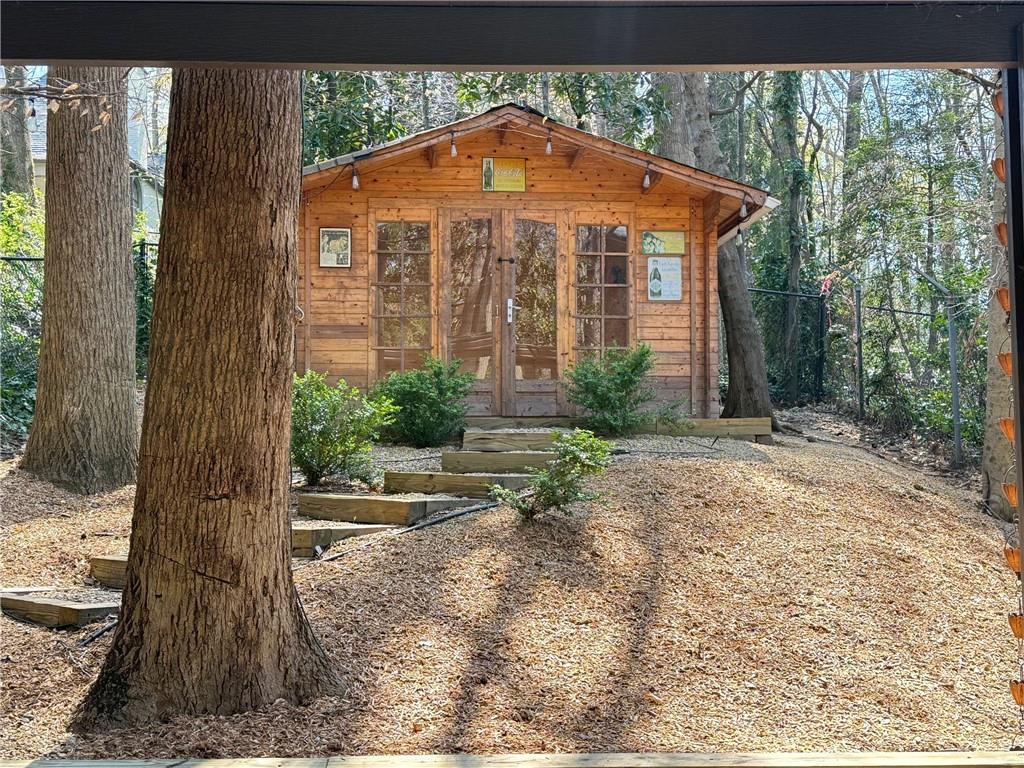 675 West Paces Ferry Road Northwest, Unit 10 Atlanta, GA 30327 - Photo 46 of 47 a front view of a house with garden