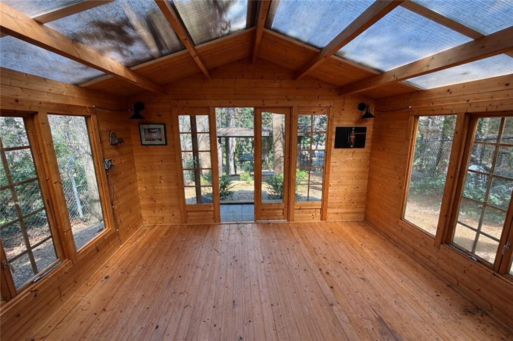 675 West Paces Ferry Road Northwest, Unit 10 Atlanta, GA 30327 - Photo 47 of 47 a view of an empty room with wooden floor and a window