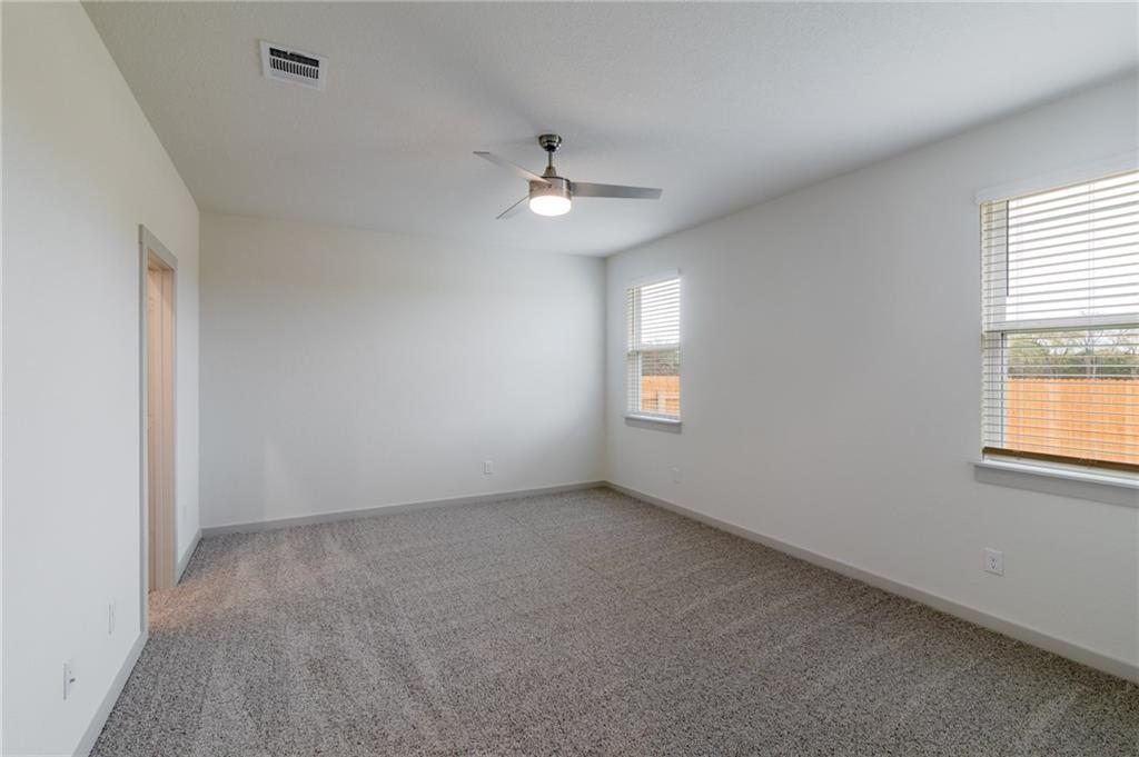 432 Agave Azul Way Leander, TX 78641 - Photo 13 of 36 The primary is located at the back of the home for ultimate privacy.