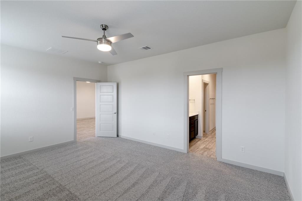 432 Agave Azul Way Leander, TX 78641 - Photo 14 of 36 With a full en suite, you'll want to unwind here after a long day.