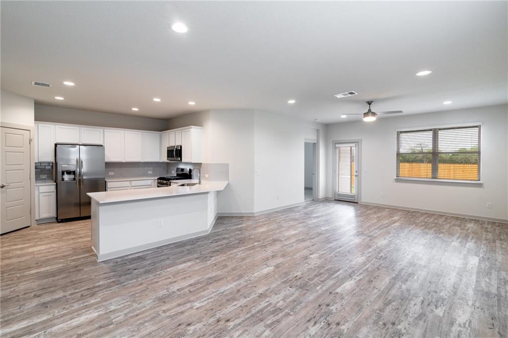 432 Agave Azul Way Leander, TX 78641 - Photo 5 of 36 Open concept living is ideal for hosting.