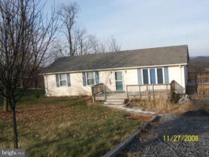 225 Granny Smith Road Linden, VA 22642 - Photo 1 of 13 a front view of a house with garden