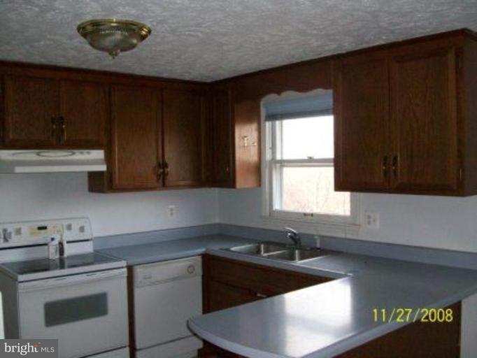225 Granny Smith Road Linden, VA 22642 - Photo 3 of 13 a kitchen with a sink and cabinets