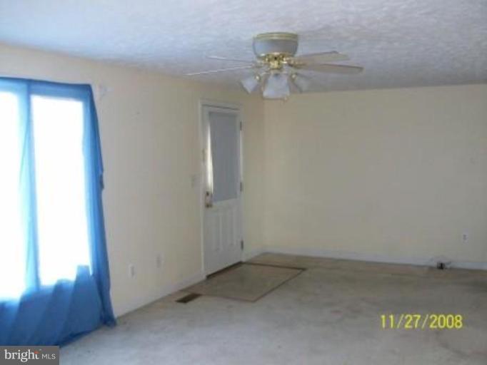 225 Granny Smith Road Linden, VA 22642 - Photo 5 of 13 an empty room with a window
