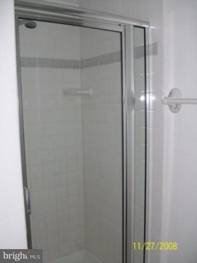 225 Granny Smith Road Linden, VA 22642 - Photo 7 of 13 a bathroom with a glass shower door