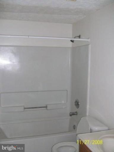 225 Granny Smith Road Linden, VA 22642 - Photo 8 of 13 a bathroom with a bathtub and toilet