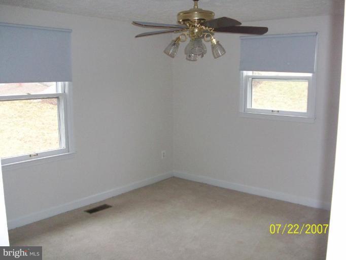 225 Granny Smith Road Linden, VA 22642 - Photo 9 of 13 an empty room with a window