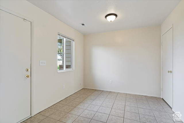 947 Canyon Road South, Unit 15 Ogden, UT 84404 - Photo 6 of 22 Unfurnished room featuring light tile patterned floors and baseboards