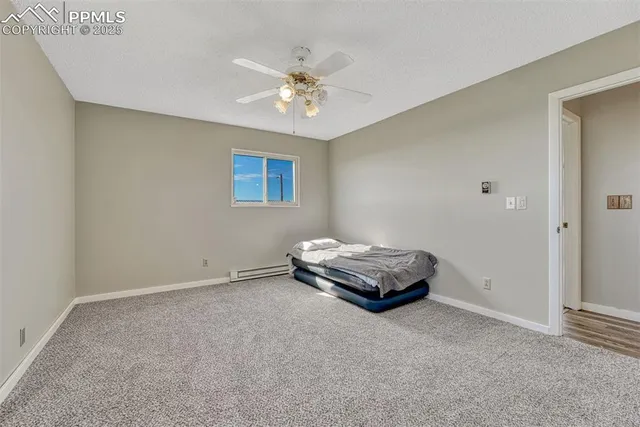 a bathroom with a sink and a chandelier
