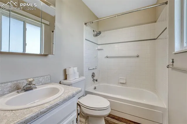 a bathroom with a sink a toilet and a bathtub