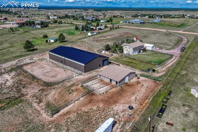 an aerial view of a house with garden