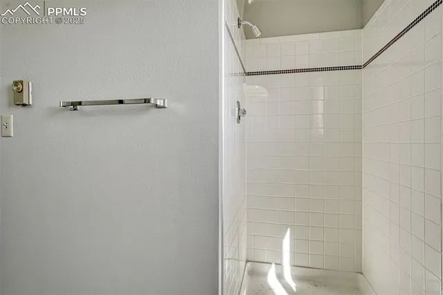 an aerial view of a house with a yard and lake view