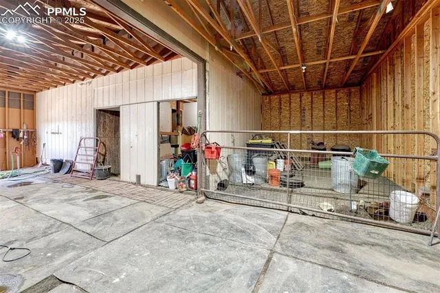 a view of a room with wooden floor and windows