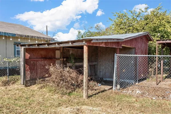 a view of a barn house next to a yard