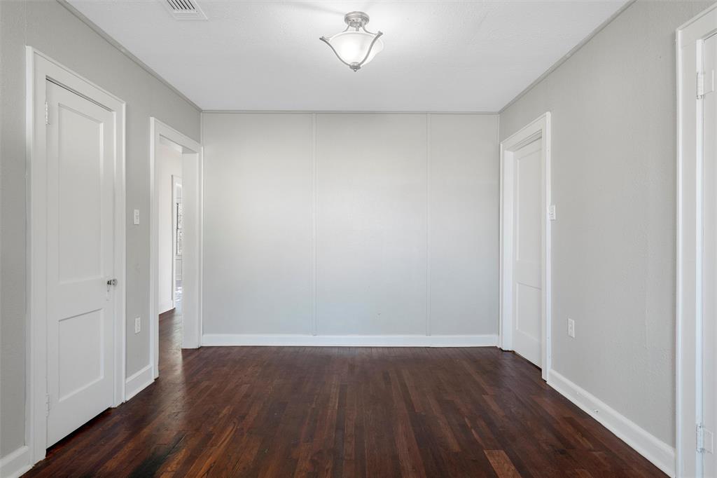 403 South 5th Street Rosebud, TX 76570 - Photo 4 of 13 a view of an empty room with wooden floor and a window