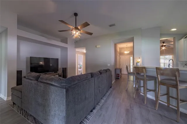 a kitchen with a sink a stove a microwave and refrigerator