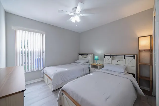 a bedroom with a bed and lamp