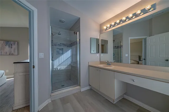 a bathroom with a sink a toilet and shower curtain