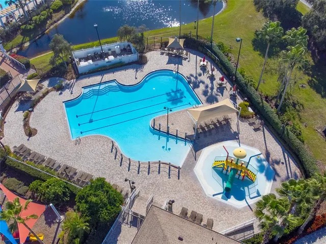 an aerial view of a house with a swimming pool