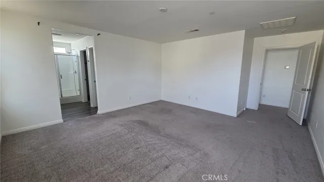 a view of a white house with a yard