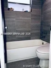 a bathroom with a toilet and a sink