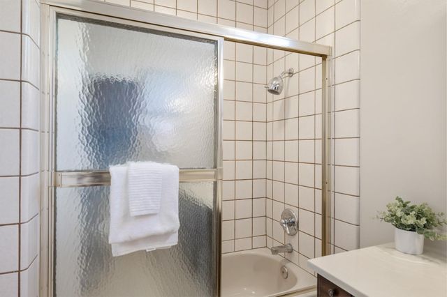 a bathroom with a toilet and shower