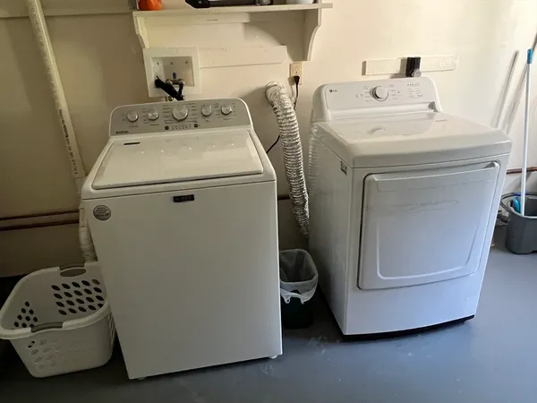 a utility room with dryer and washer