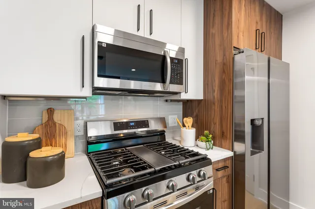 a kitchen with a stove and a microwave