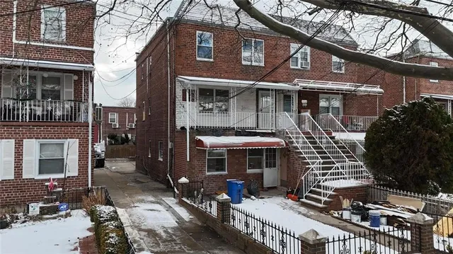 a front view of a house with parking area