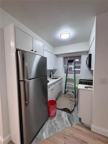 a front view of a building with parking space