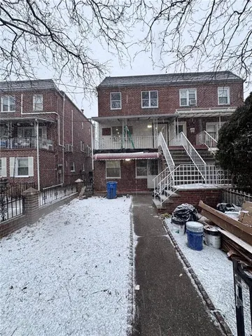 a dining room with furniture a chandelier and wooden floor
